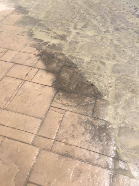 reveal of patterned concrete below dirt and grime reveal of patterned concrete below dirt and grime